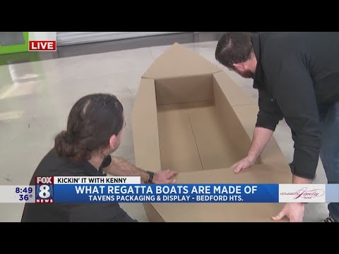 Kenny checks out boat construction before he sets sail in Lakewood H.S. Regatta