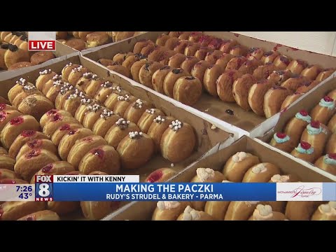 Kenny's surrounded by paczki's at Rudy's in Parma