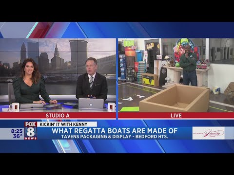 Kenny checks out boat construction before he sets sail in Lakewood H.S. Regatta