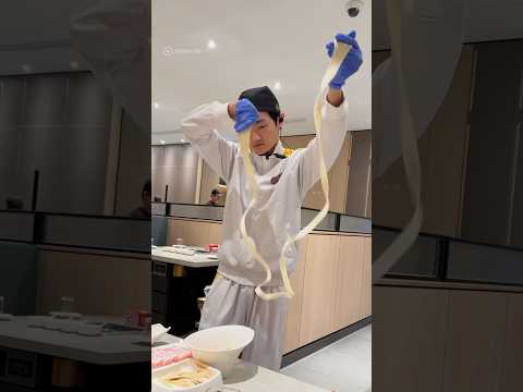 Chef performs while preparing ramen noodles in Malaysia #shorts