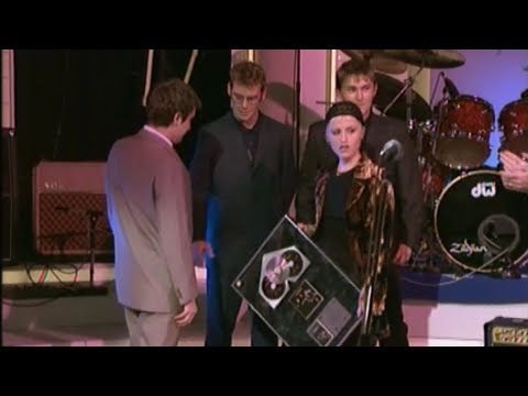 Dave Fanning presents The Cranberries with a platinum disc on ‘The Late Late Show’ 1994