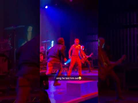 crazy fan gets knocked out on stage