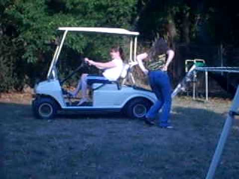 Jessica and Caetie on the golf cart.