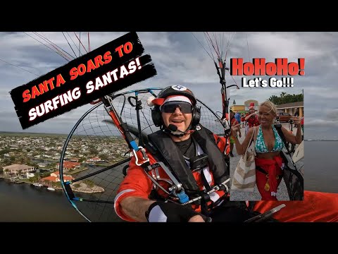 Santa Soars Against the Storms: Epic PPG Flying Adventure Over Surfing Santas 2023 Holiday Tale