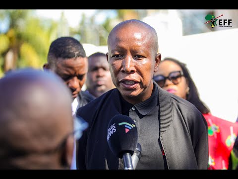 President  Julius Malema addressing members of the media outside the Modise home.