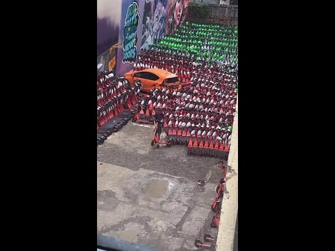 Man's car surrounded by scooters in Brisbane