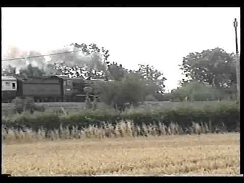 Nunney Castle passing Yarnbrook on The Weymouth Seaside Express - 24th July 2011.avi