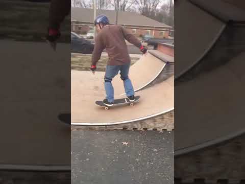 Kyle skateboarding a spine!!