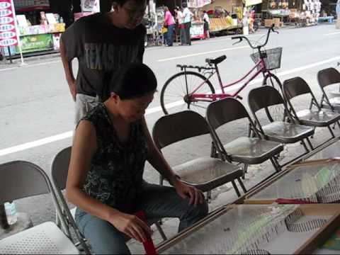 Qijin street market marble stand 旗津市場打彈珠