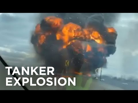 Huge fire erupts after tanker carrying fuel rolls over