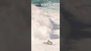 Man on a jetski saves surfer from 30 foot wave