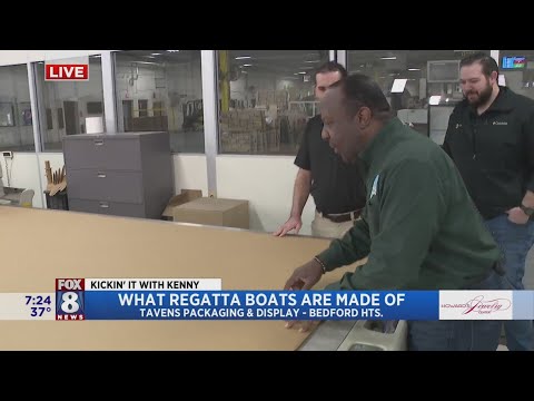 Kenny checks out boat construction before setting sail in Lakewood H.S. Regatta