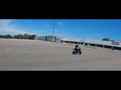 Hollie learning to ride a 2022 Honda Grom