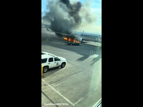 12 injured while evacuating American Airlines plane fire at Denver airport