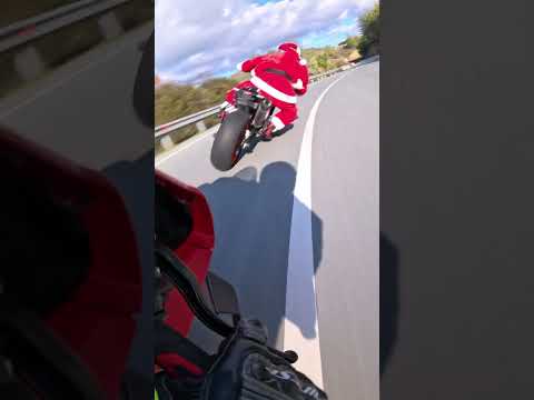 Santa Clause Riding A Motorcycle Knee Down