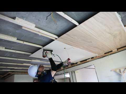 process of a middle-aged man tearing down an old house and remodeling it into a new house.