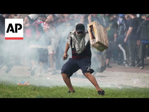 Argentina retirees and soccer fans clash with police during protest