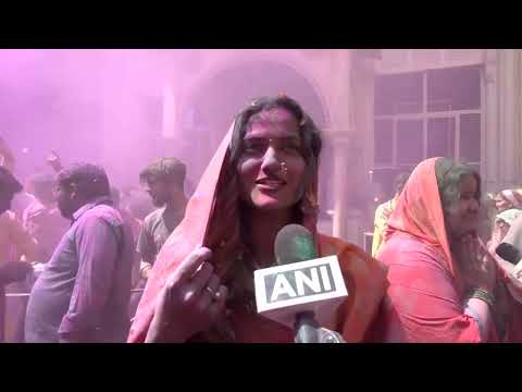 Indian widows mark Holi festival with colored dyes and flowers