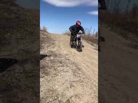 Kyle making a jump on the dirt bike