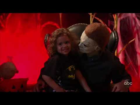 Little girl hugs Michael Myers